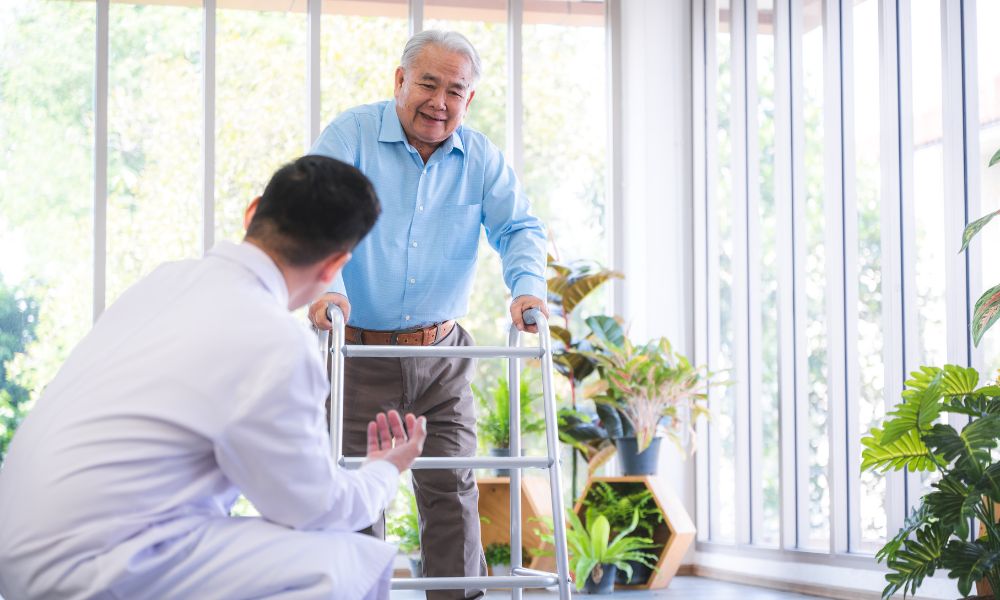 Orthopedic Doctor helping patient walk